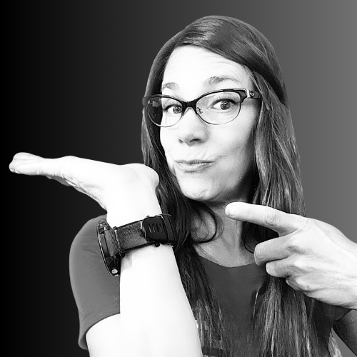 Profile picture of Heather Voorhis with glasses on pointing at text to the left.